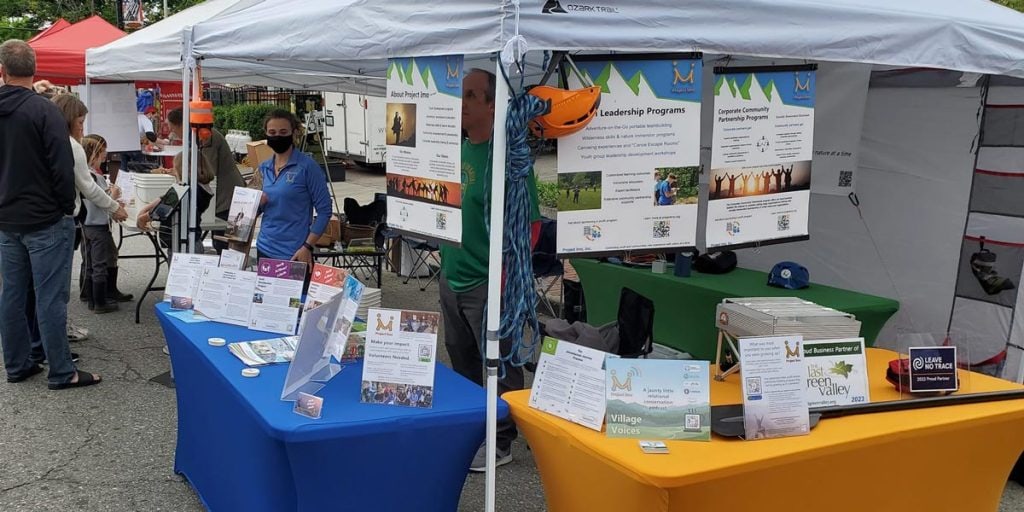 Willimantic 3rd thursday street fest project imo booth with marketing materials