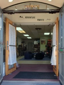 Adventure Awaits Sign above Entrance Door to base camp and teen center